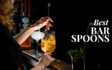 Bartender stirring a cocktail in a stemmed glass with a long bar spoon