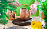 Making a cold drink in copper mugs