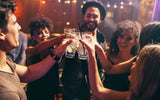 A group of friends toasting their cocktails