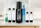 SodaStream machine with carbonating bottle on a kitchen counter