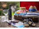 Luggage with wine bottle and glasses