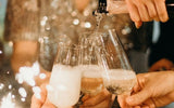 Group of friends cheering with champagne in Champagne flutes.