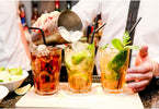 Barman preparing 3 different cocktails